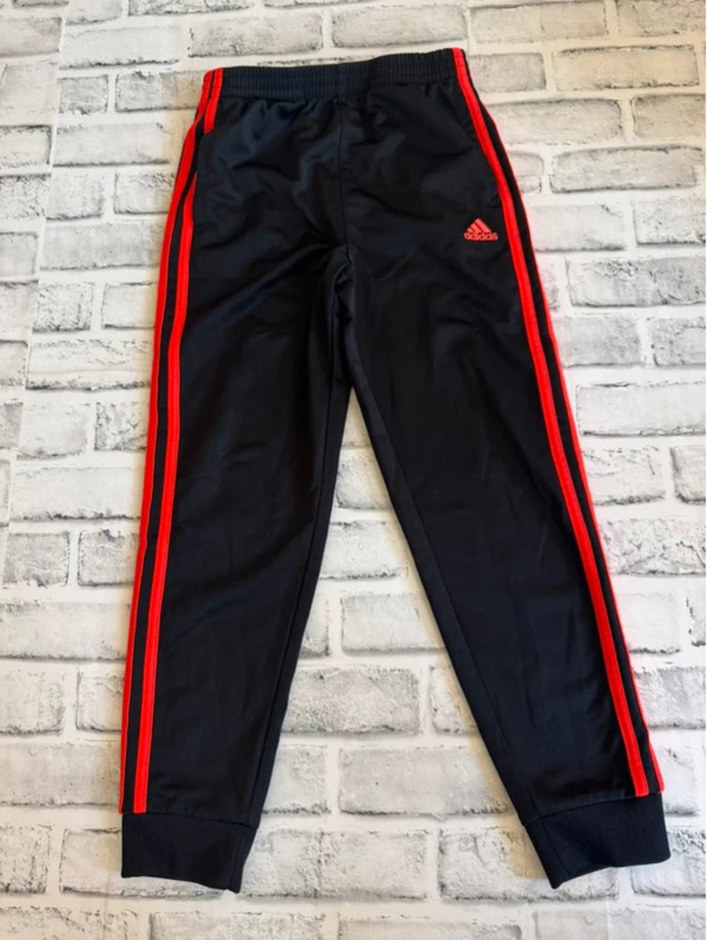 Boy’s Adidas athletic joggers black and red size 7